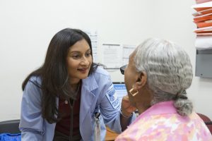 PA Kanumury in front of the Woodlawn Health Center