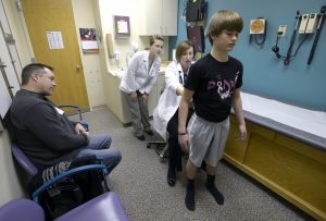 PA Jenny Flaherty examines a patient