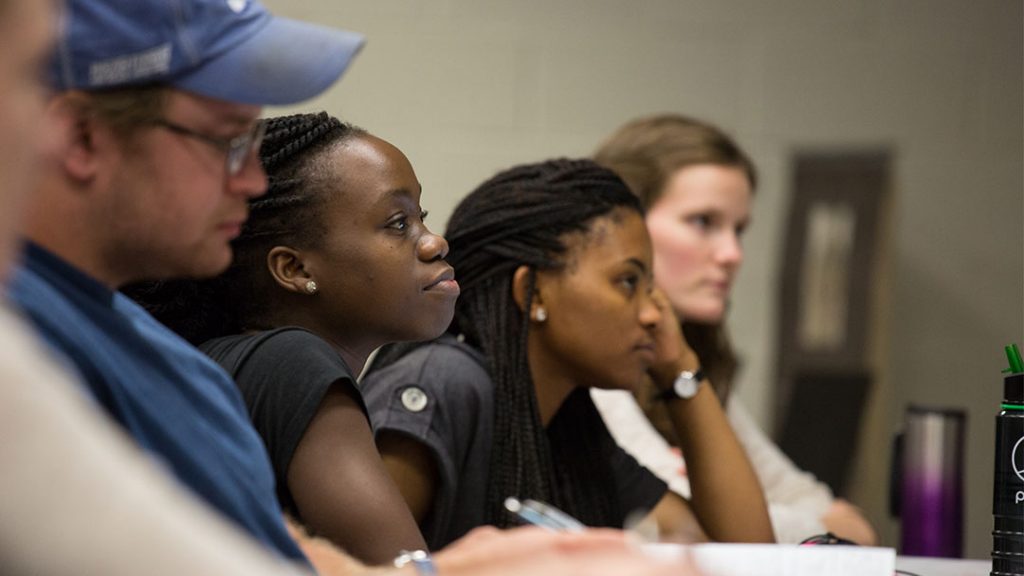 People listening to a class