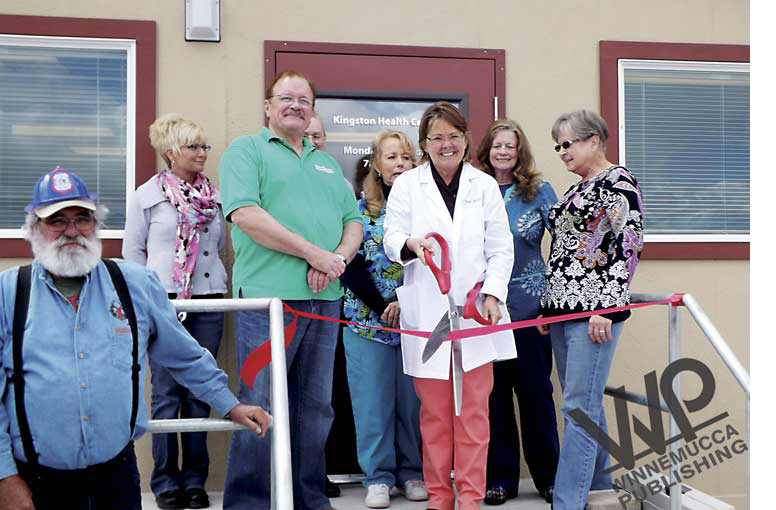 Ann Miles cutting the ribbon at Kingston Health Center