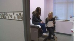 Stephanie Howard speaks with a patient