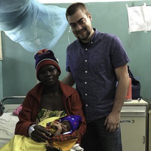 Matt Tieszen with the patient and child he helped with a transfusion