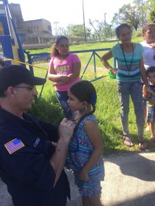 Frank Caruso examines a patient in Puerto Rico