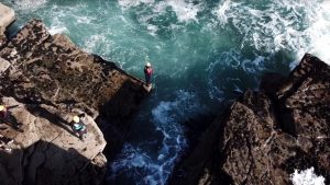 PA Ciara Melia about to take the plunge off a cliff into the treacherous waters of Ireland’s west coast in winter