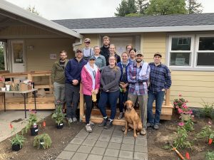 PA students from Pacific University helping with landscaping and clearing a house that will be used as a day-service building for homeless adults in Washington County
