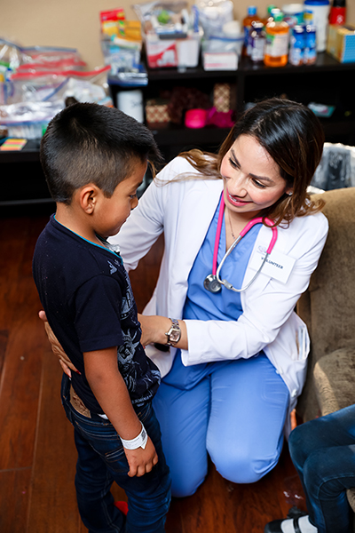 PA Elizabeth Lopez-Murray providing medical care to a Guatemalan child