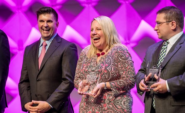 DeTroye laughing while accepting her EOE award alongside two others