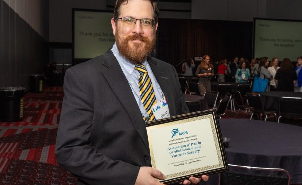 David Bunnell posing with his award.