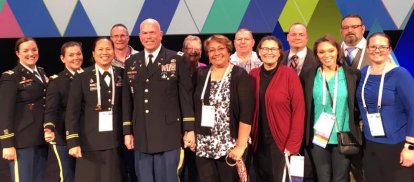 Military PAs join 2019 AAPA Military Service Award recipient Col David Hamilton on stage
