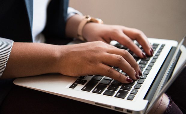 Person using a MacBook Air