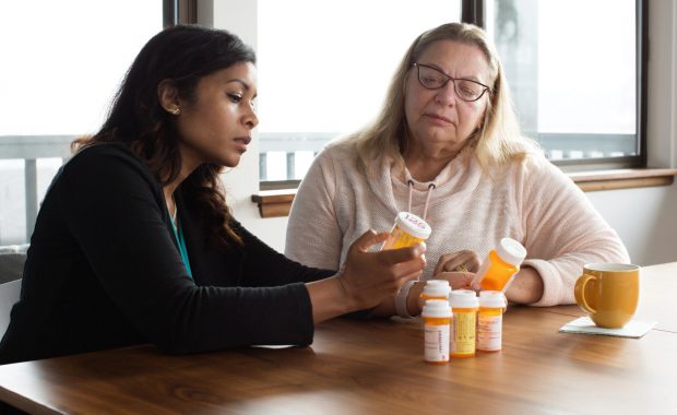 Sharmila Sewell performing a medication reconciliation in her patient's home