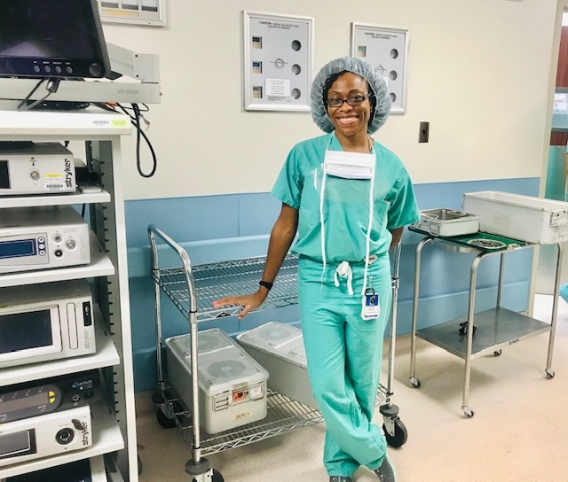April Frowner in her scrubs