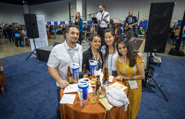 Four AAPA conference attendees at the Exhibit Hall