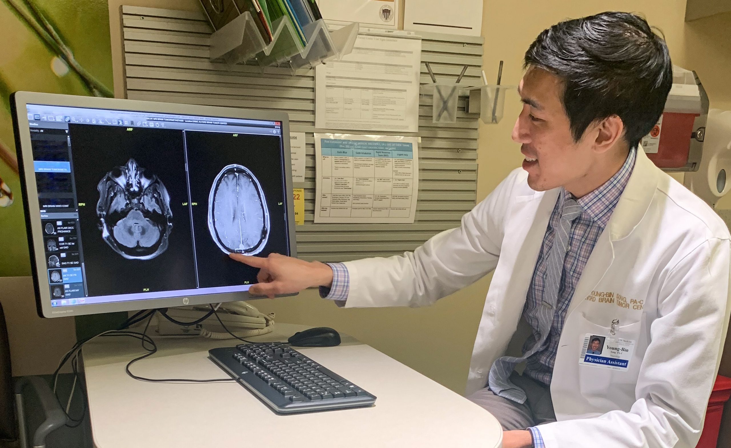 Young-Bin Song pointing to an MRI scan