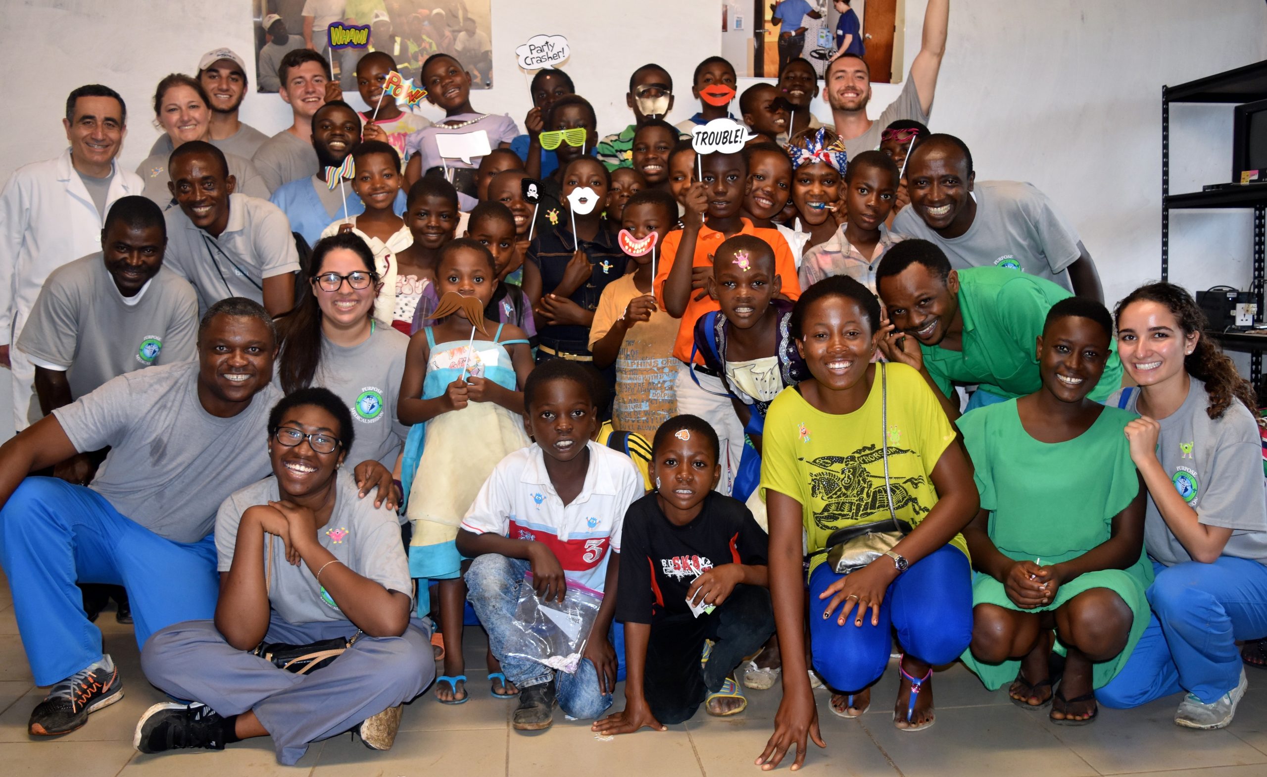 Sixtus Atabong with his fellow providers and local children in Cameroon