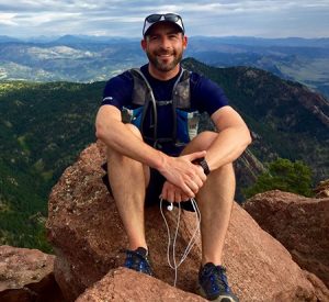 David Braun sitting on a rock