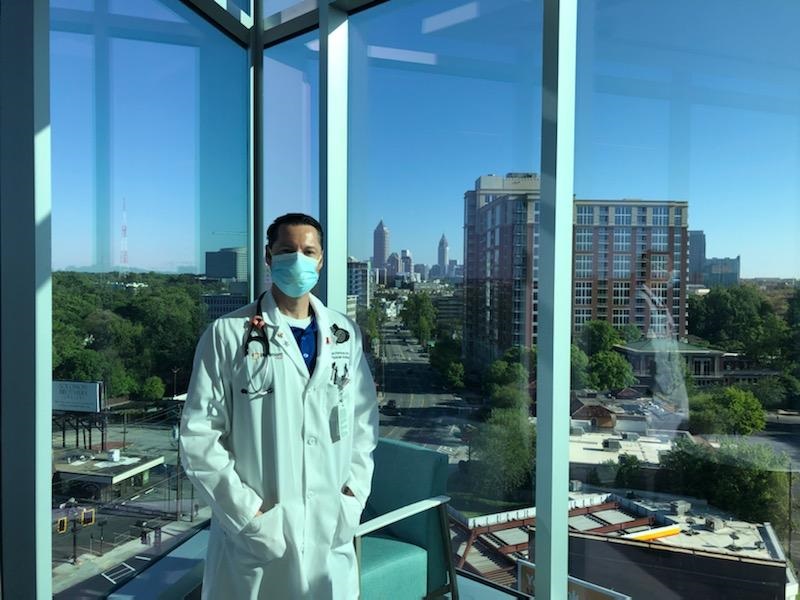 Kyle D. Fortman standing in front of a window