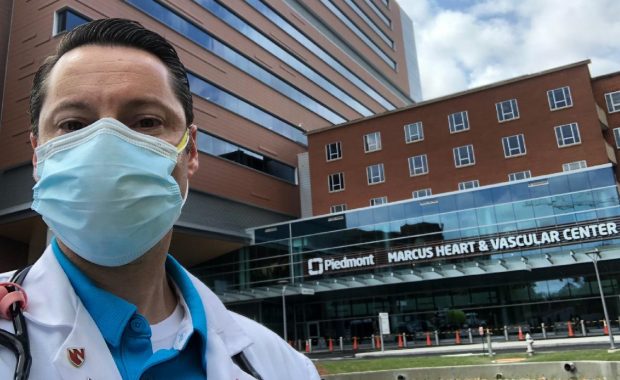 Kyle D. Fortman in front of the Piedmont Marcus Heart and Vascular Center