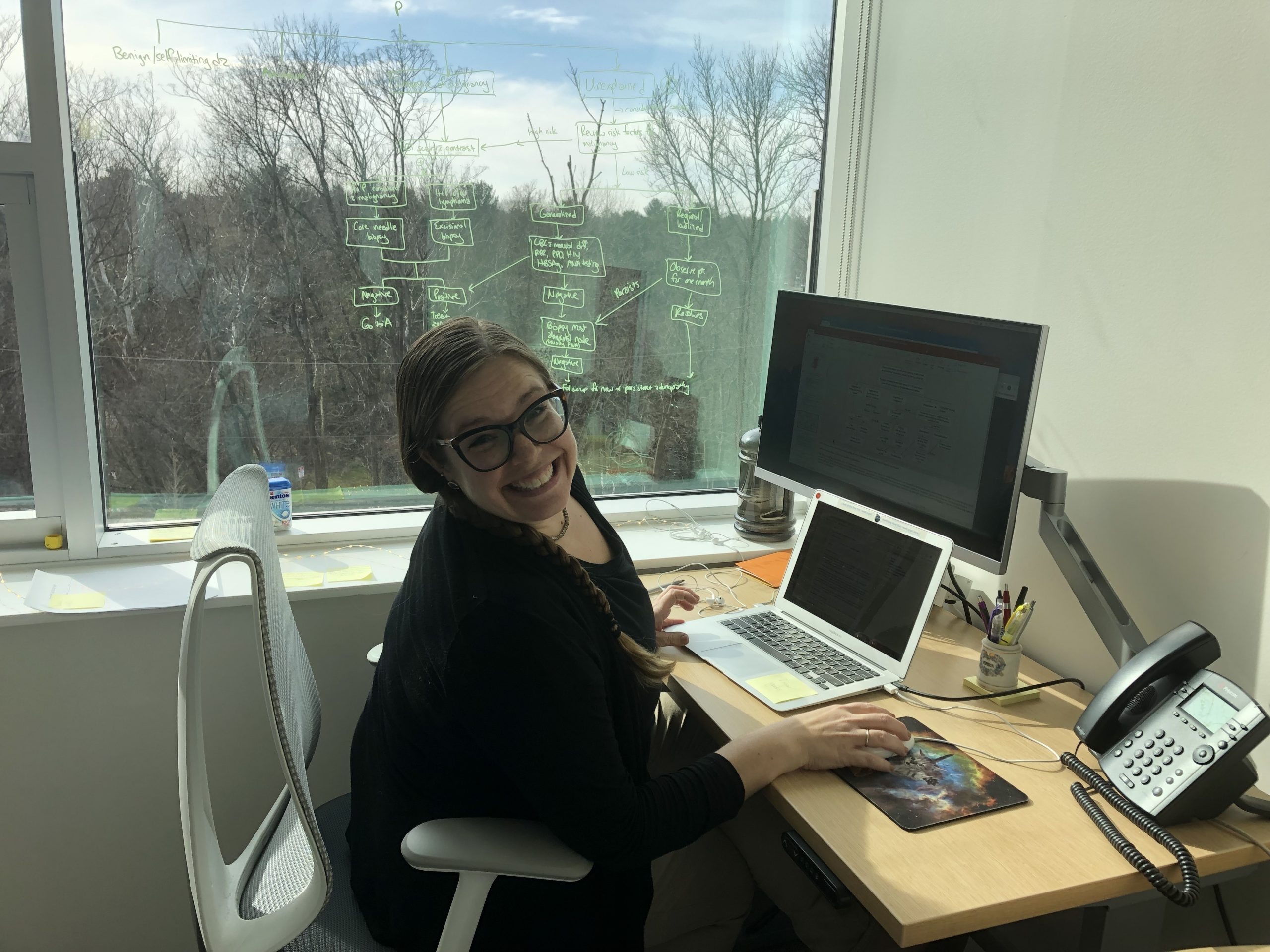 Nicole S. Cournoyer working on a lecture in her office