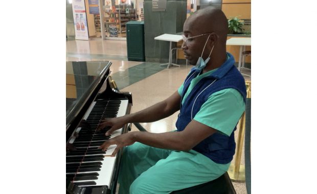 Christophe E. Jackson playing the piano