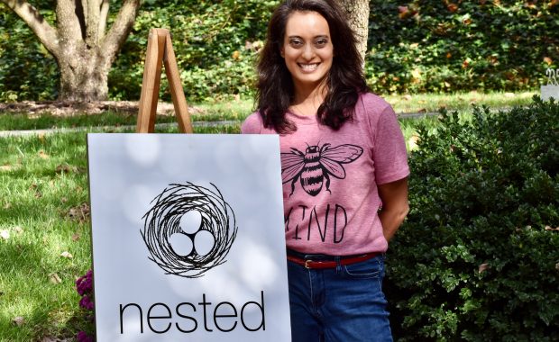 Nidhi Reva with a poster for Nested