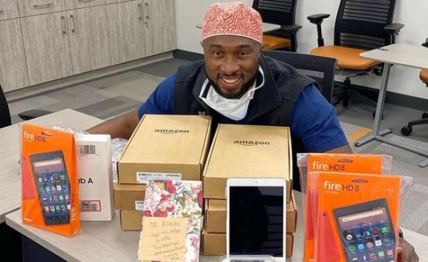 Adkins with the donated and fundraised tablets