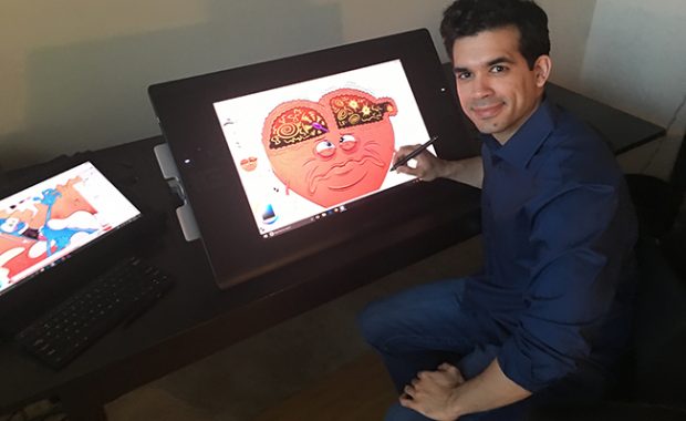 Jorge Muniz with one of his illustrations