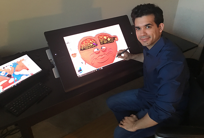 Jorge Muniz with one of his illustrations