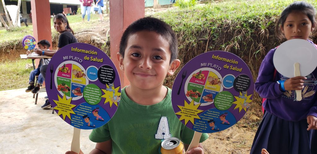 A child posing with medical education resources