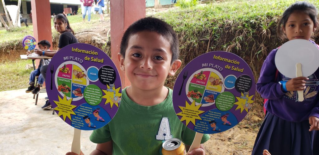 A child posing with medical education resources