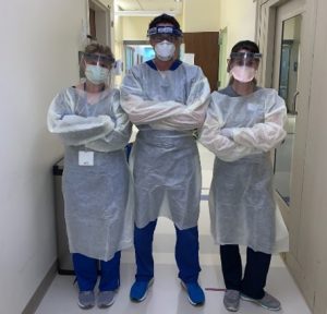 3 PAs (physician associates/physician assistants) wearing PPE