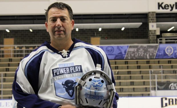 Physician associate/physician assistant Glenn Buczkowski memorializes his father, a cancer victim, on his hockey helmet.