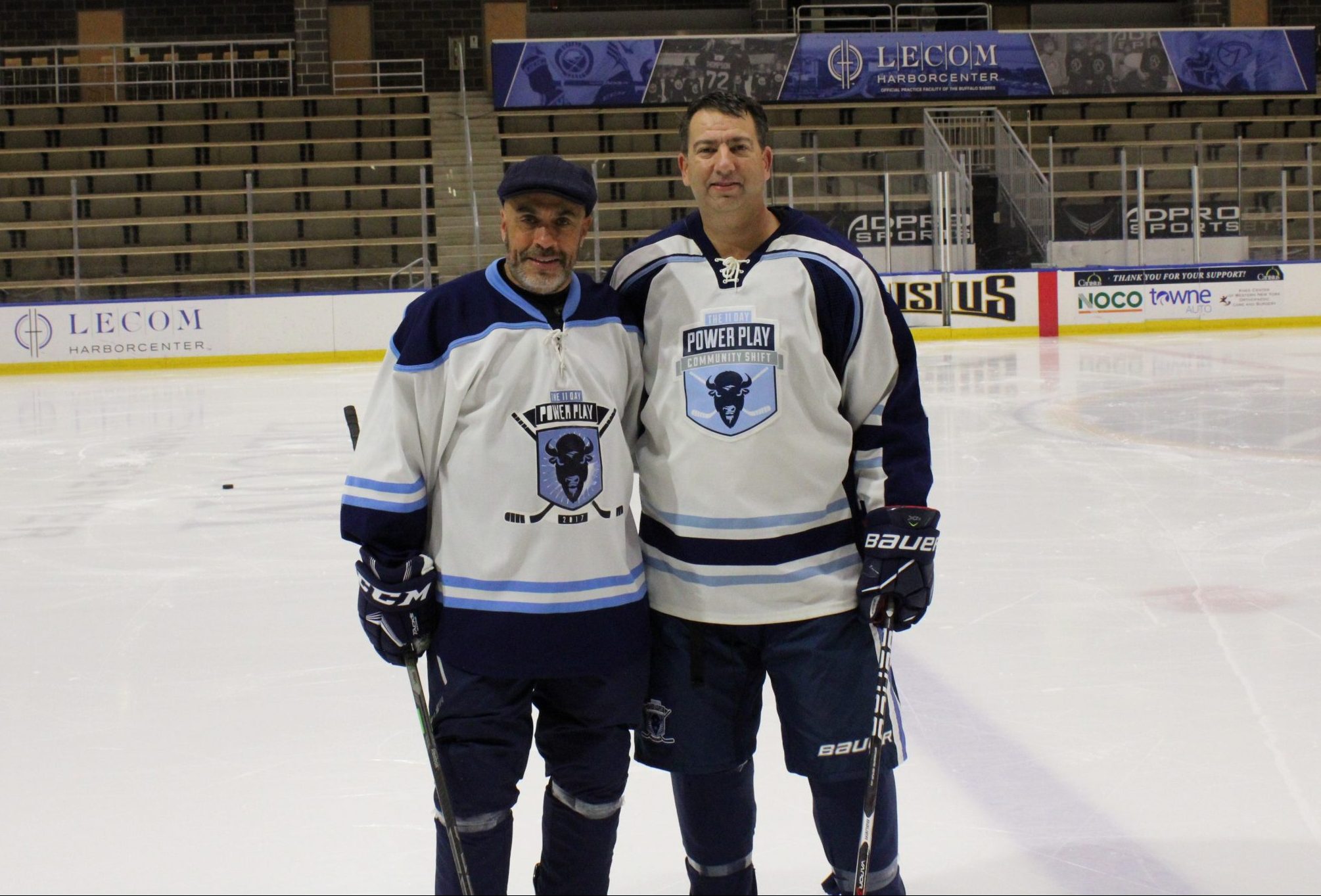 PAs (physician associates/physician assistants) Andrew Case Glenn Buczkowski standing on the ice