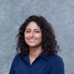 Professional headshot of a young Afghan American woman