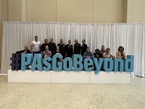 Group of people with a PAs Go Beyond sculpture